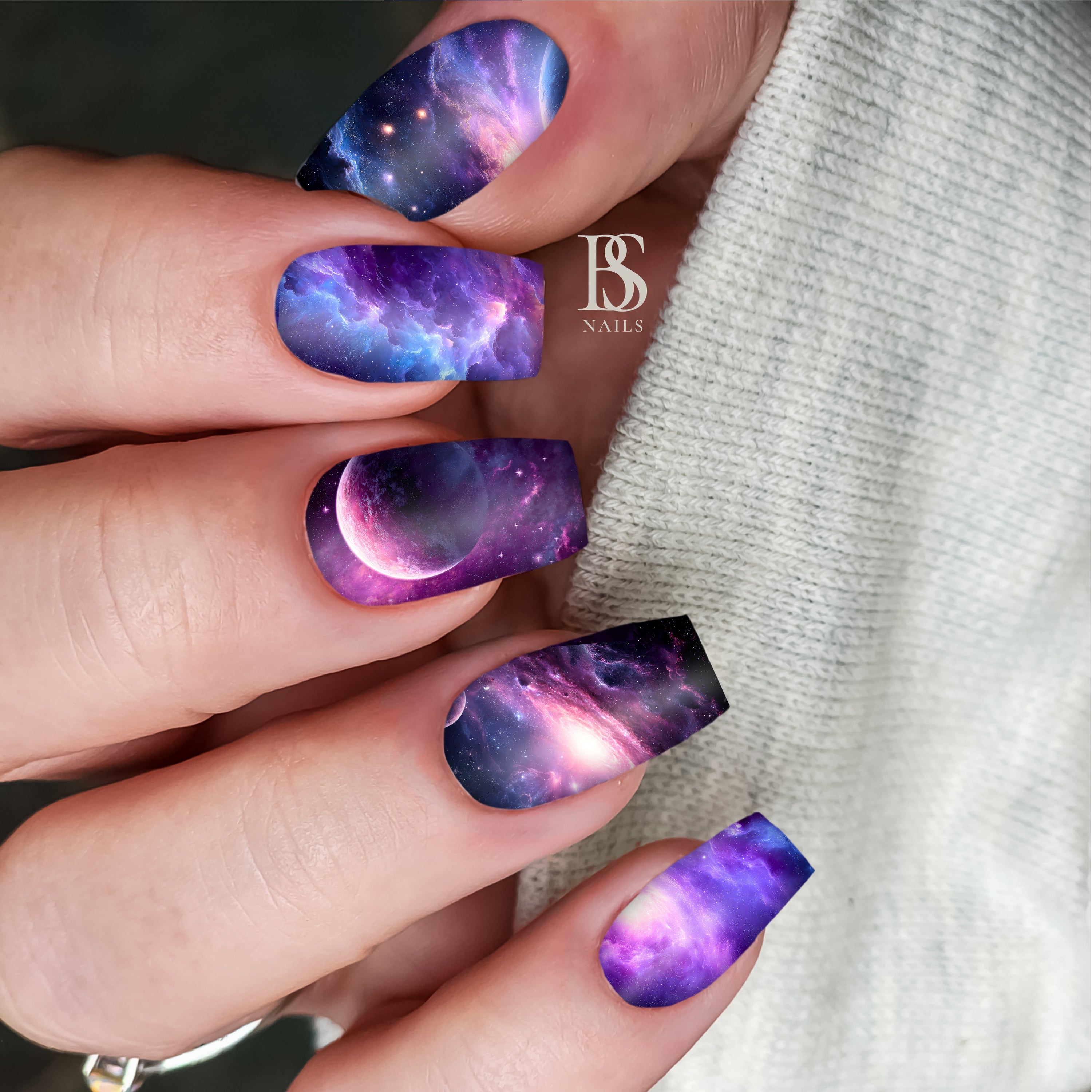 Nails with galaxy design.