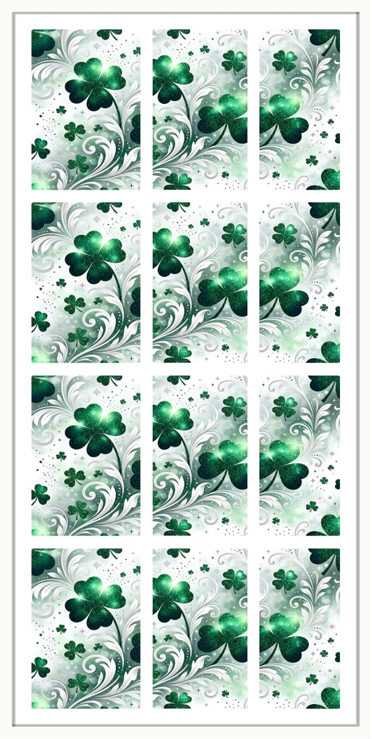 Set of green shamrock designs on a white background